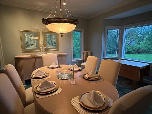 a view of a room with a large window with outer view