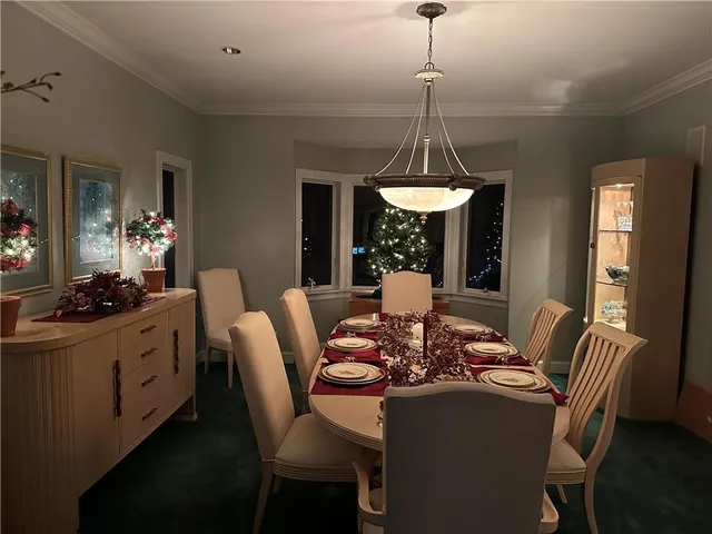 a view of a livingroom with furniture and front door