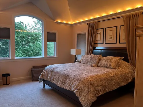 a view of a hallway and dining room with a cabinet door