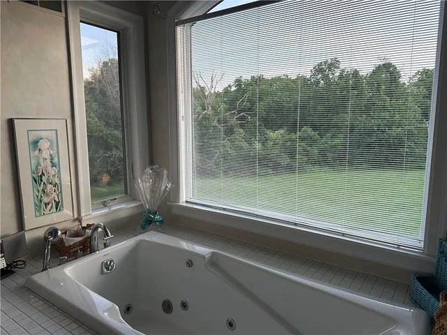 a living room with furniture and large window