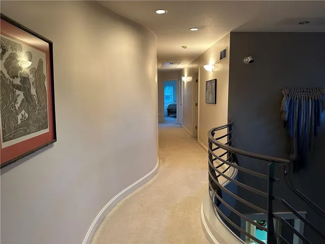 a bed room with furniture and a flat screen tv