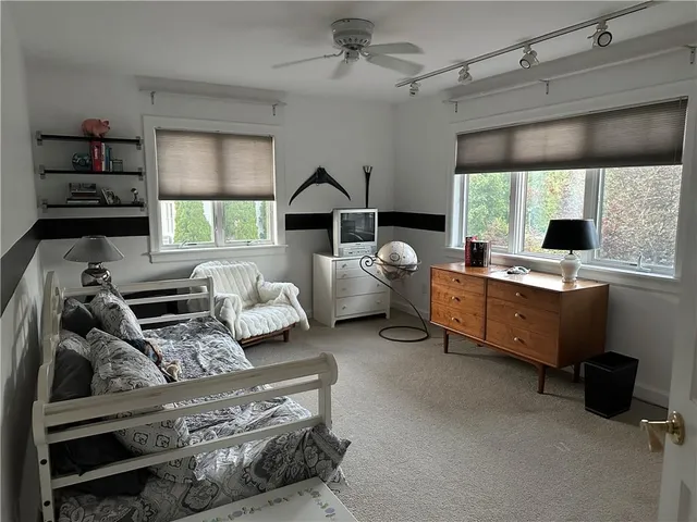 a bedroom with furniture and a window