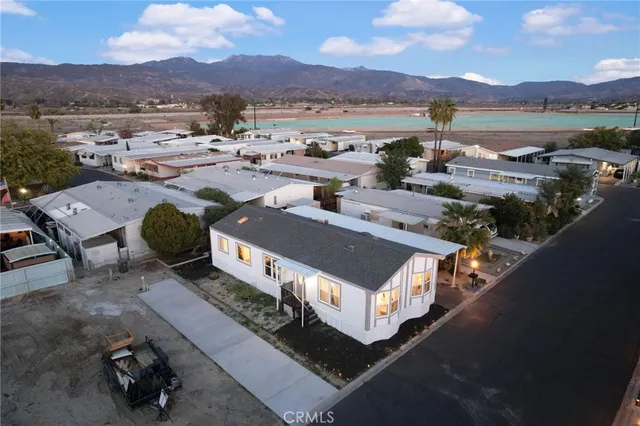 an aerial view of a house with a mountain view
