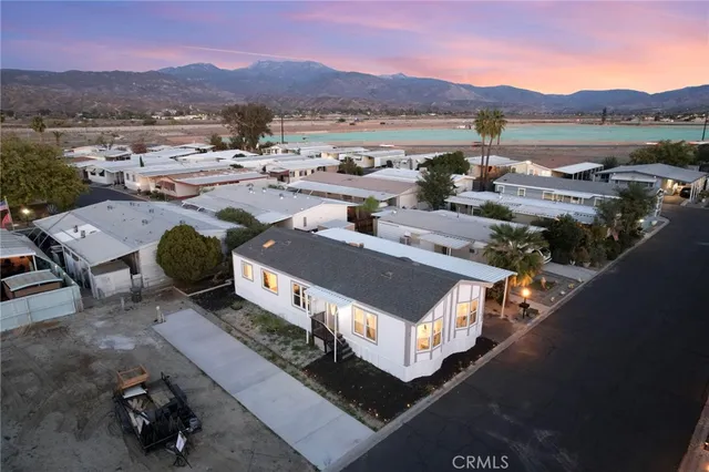 an aerial view of a house with mountain view