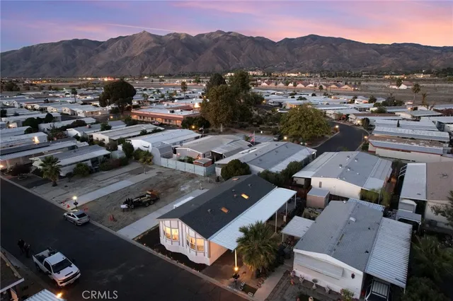 an aerial view of residential house with parking