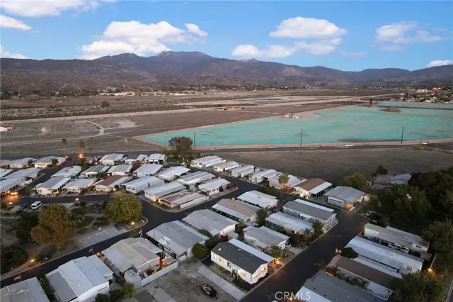 an aerial view of a house with a lake view