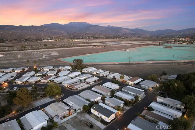 an aerial view of a house with a lake view