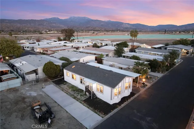 an aerial view of a house with mountain view