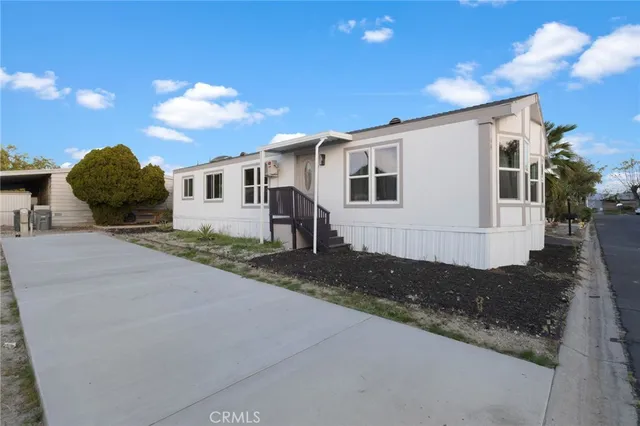a front view of a house with yard