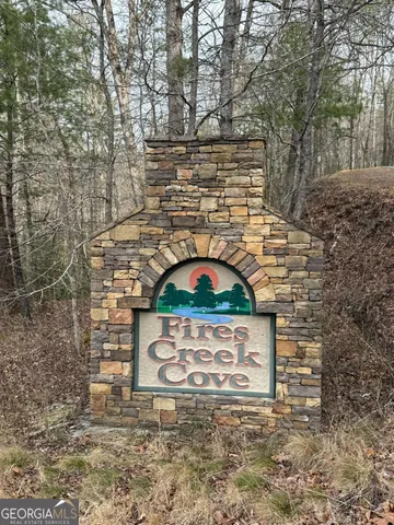 a view of a brick wall with an outdoor space