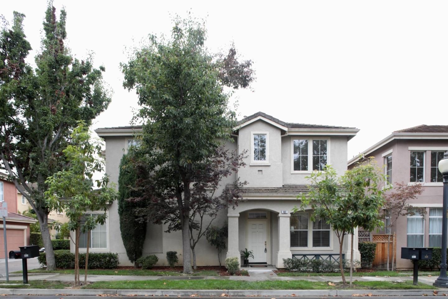 461 Whisman Park Drive Mountain View, CA 94043 - Photo 1 of 26 a front view of a house with a yard and trees