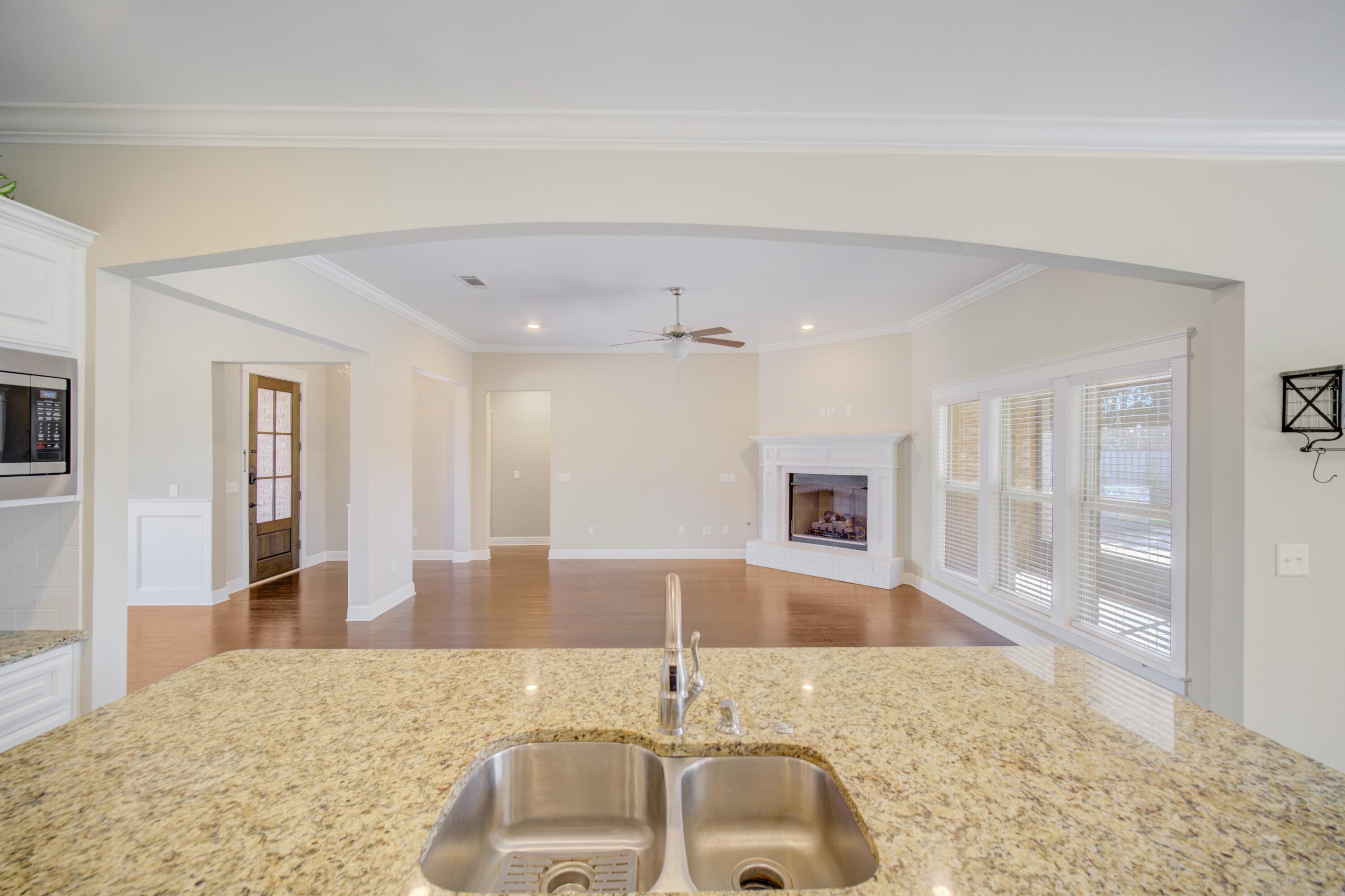 136 Buxtons Way Freeport, FL 32439 - Photo 15 of 59 a bathroom with a granite countertop sink and tub