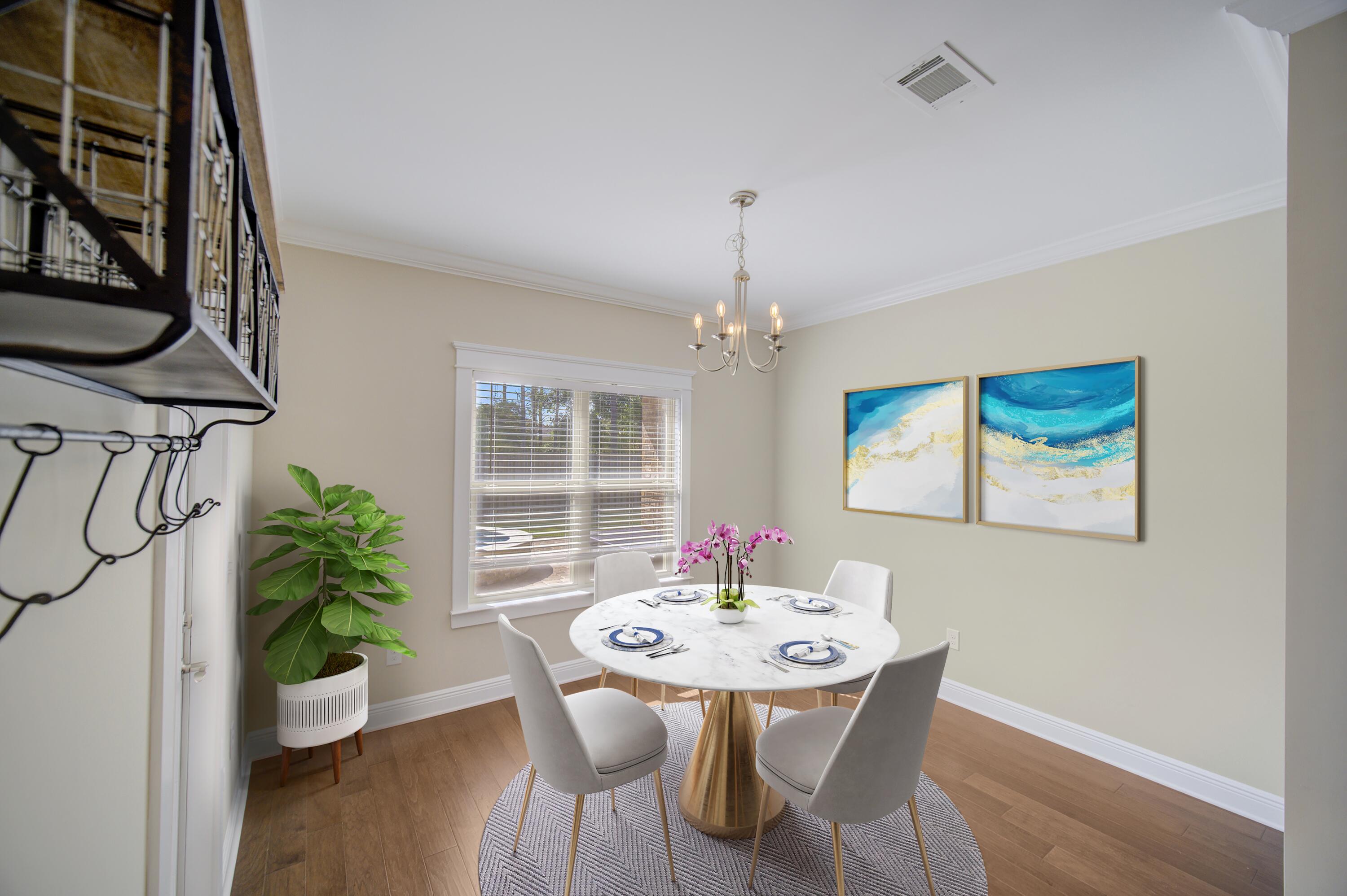 136 Buxtons Way Freeport, FL 32439 - Photo 17 of 59 a view of a dining room with furniture and wooden floor