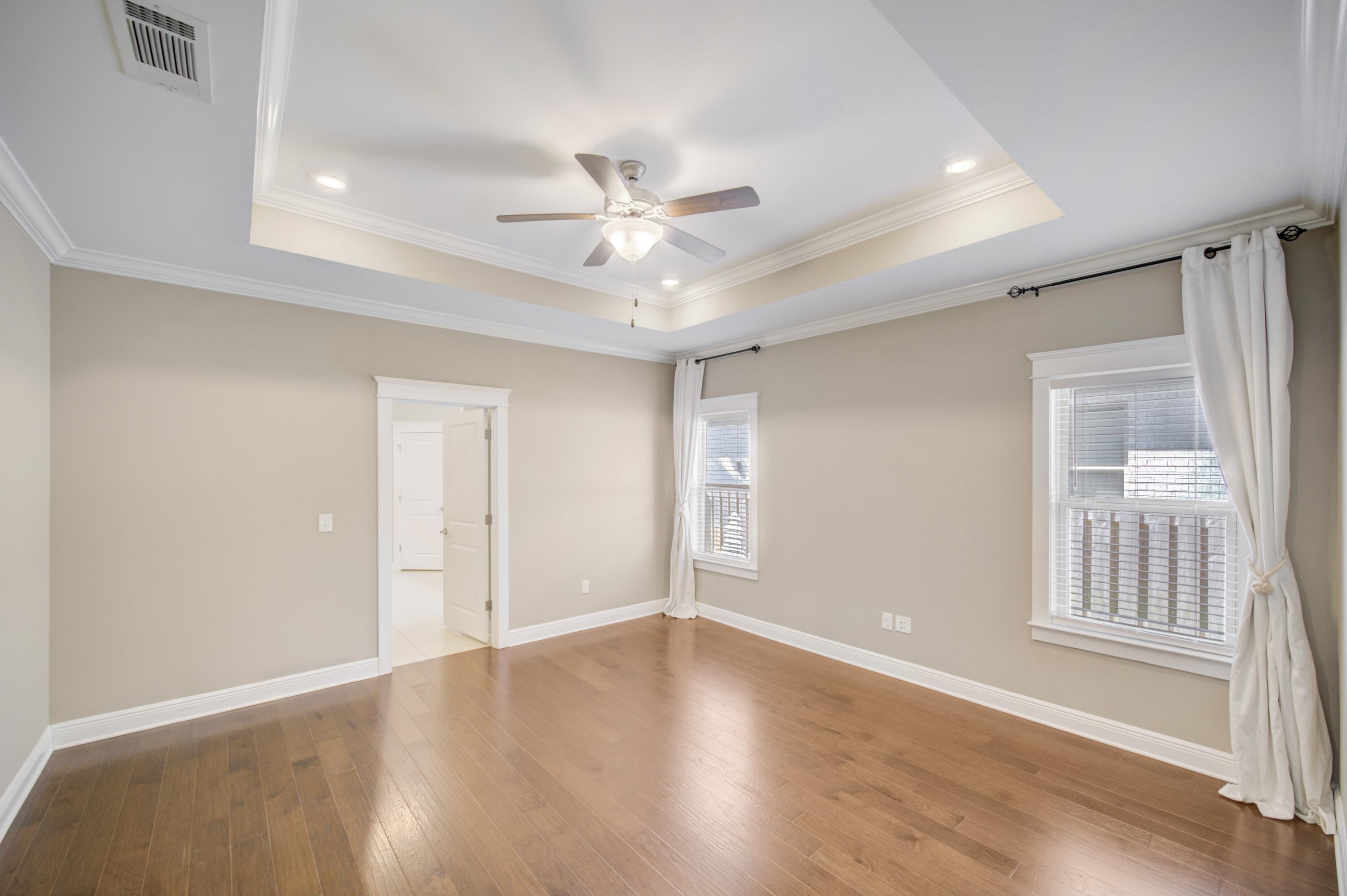 136 Buxtons Way Freeport, FL 32439 - Photo 22 of 59 a view of an empty room with window and wooden floor