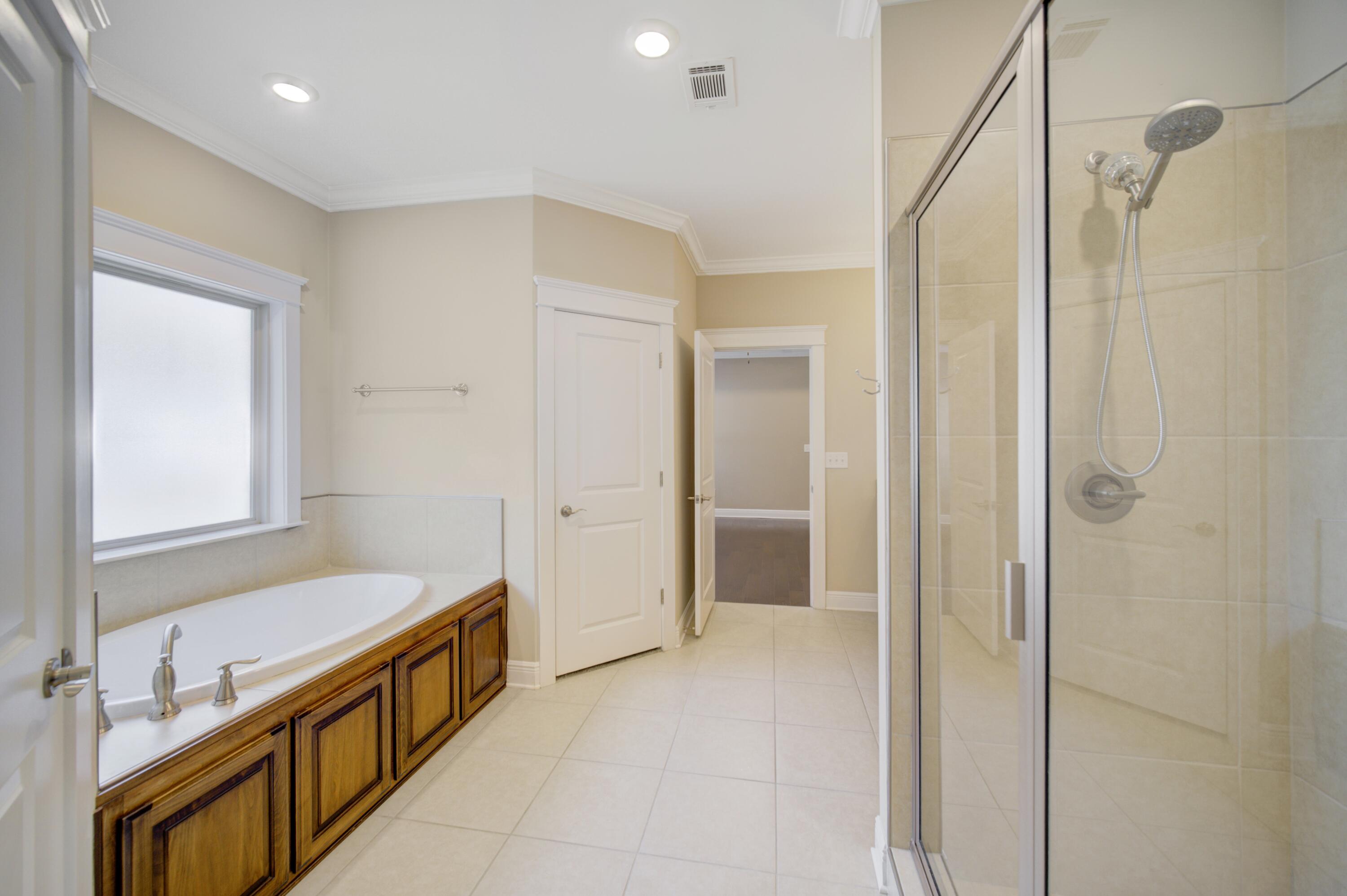 136 Buxtons Way Freeport, FL 32439 - Photo 25 of 59 a bathroom with a tub and a sink