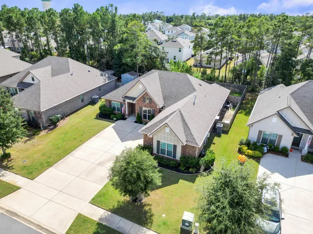 a view of a two chairs in the park