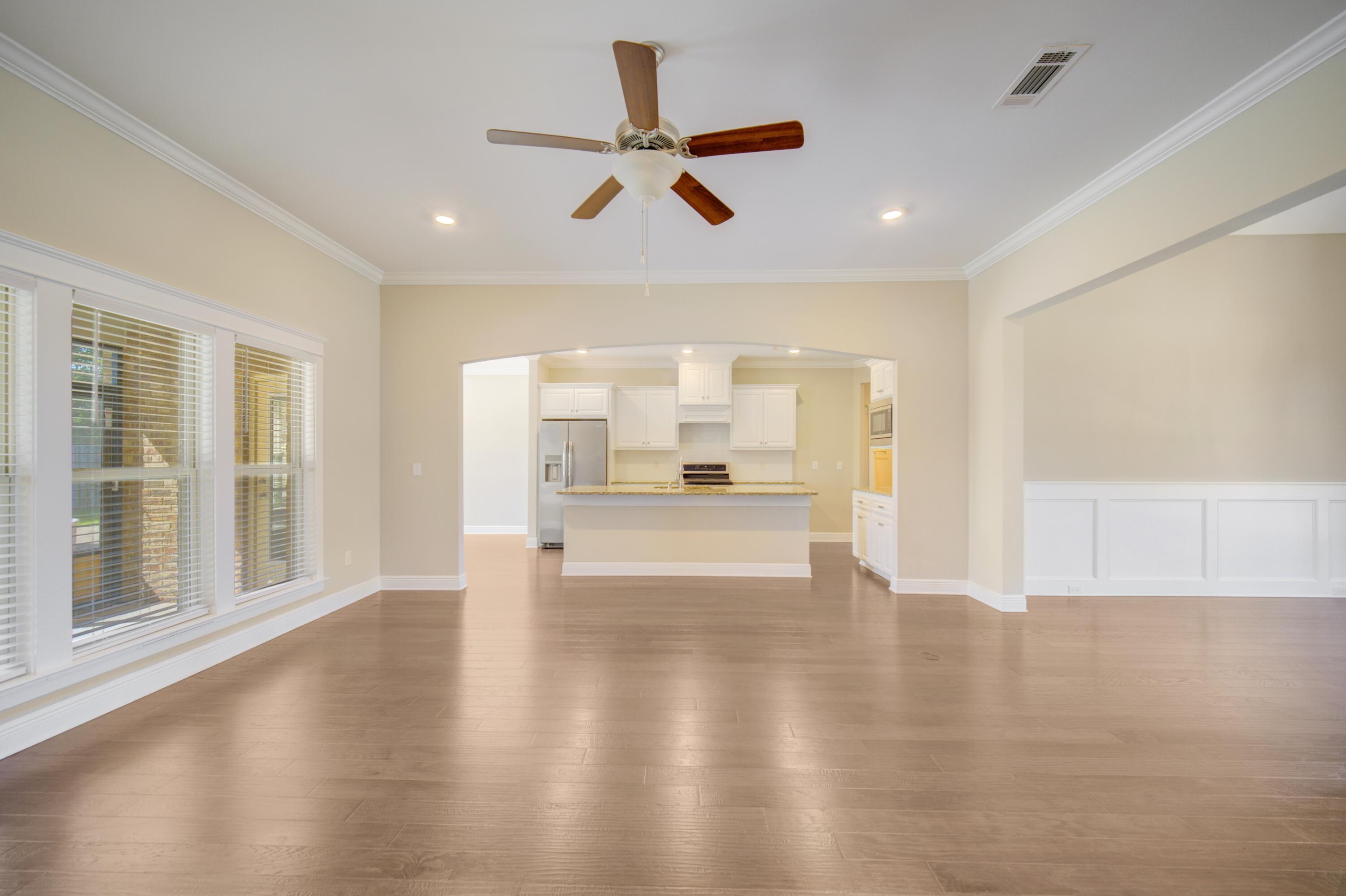 136 Buxtons Way Freeport, FL 32439 - Photo 5 of 59 a view of an empty room with a kitchen