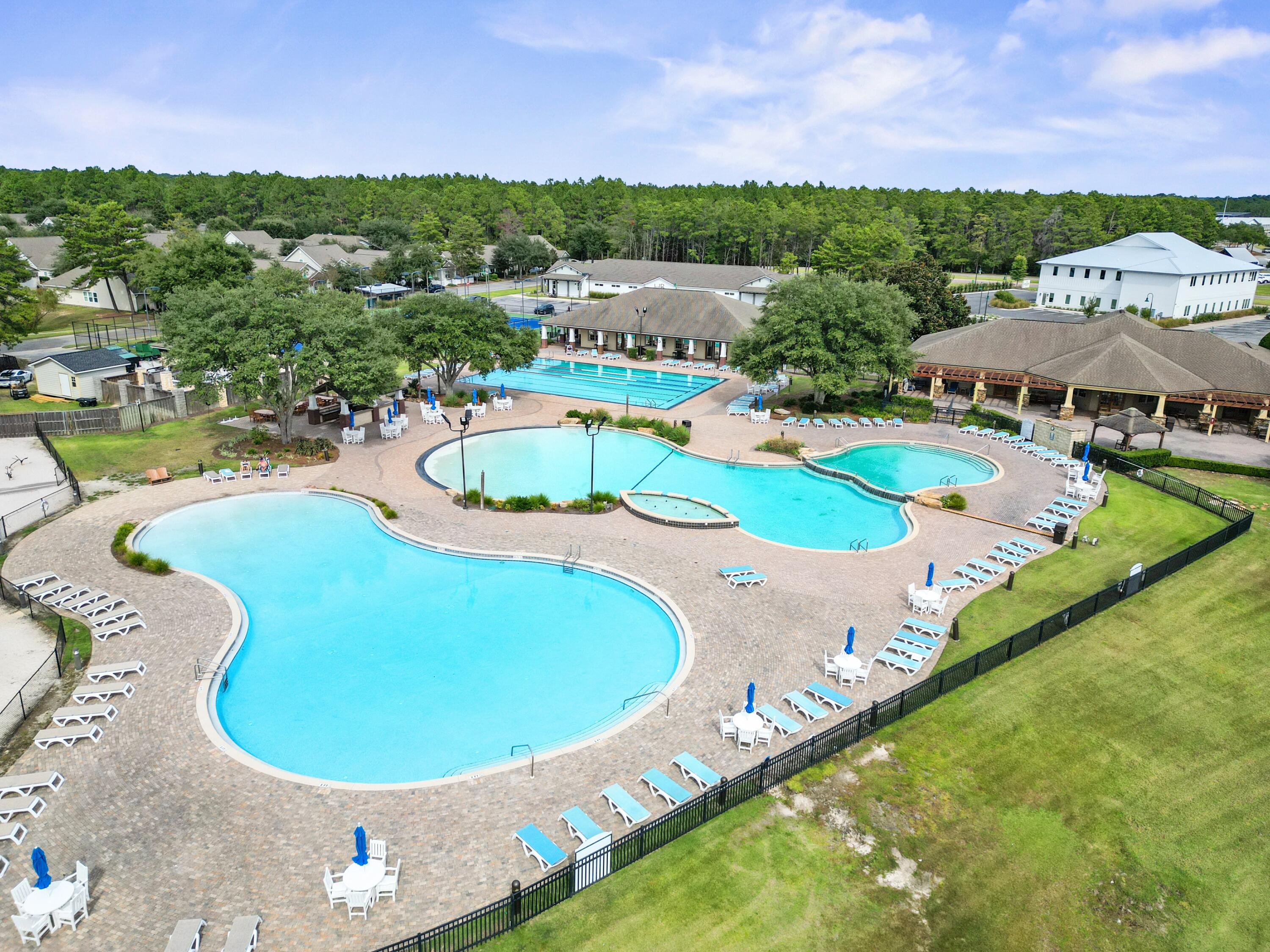 136 Buxtons Way Freeport, FL 32439 - Photo 57 of 59 a view of a swimming pool with a yard and lake view