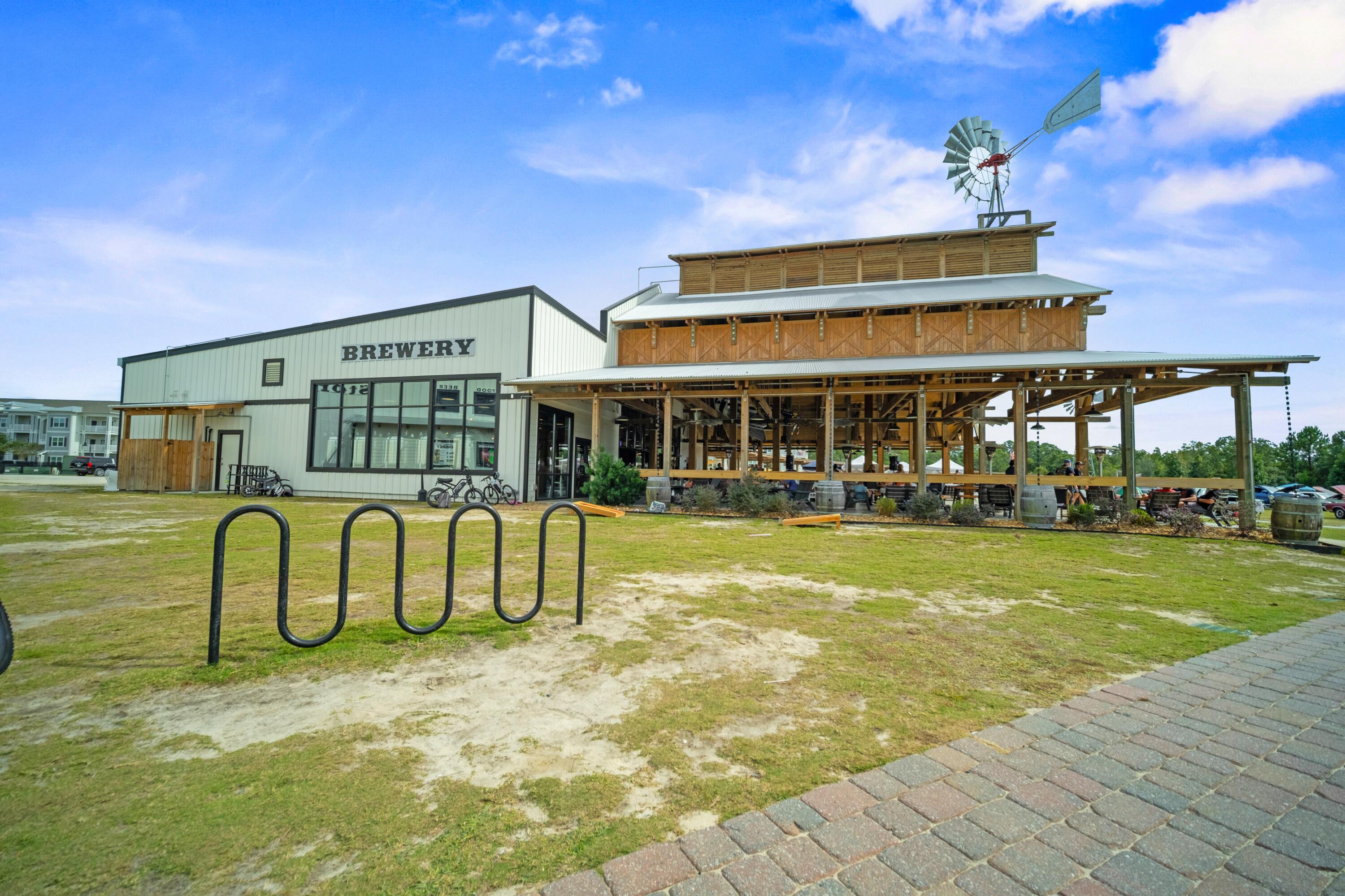 136 Buxtons Way Freeport, FL 32439 - Photo 59 of 59 a view of a swimming pool with a bench in front of house