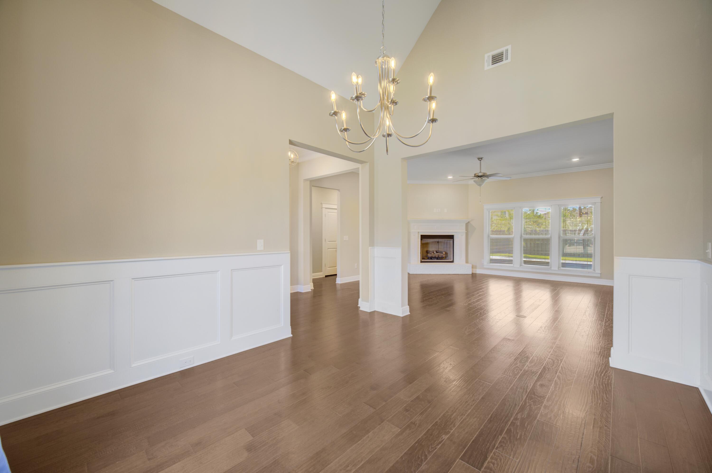 136 Buxtons Way Freeport, FL 32439 - Photo 10 of 59 wooden floor in an empty room with a window