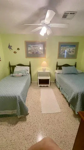 a bedroom with a bed and couch