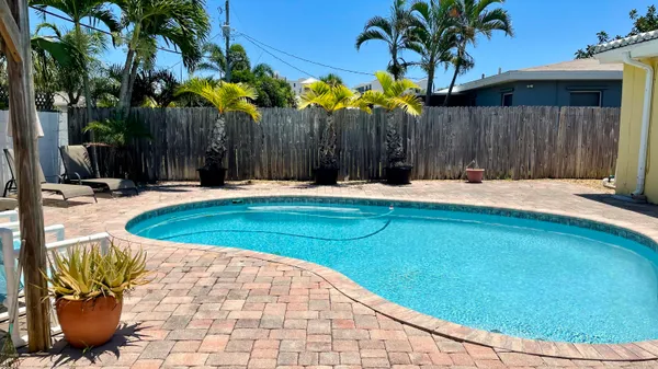 a view of a backyard with a small pool