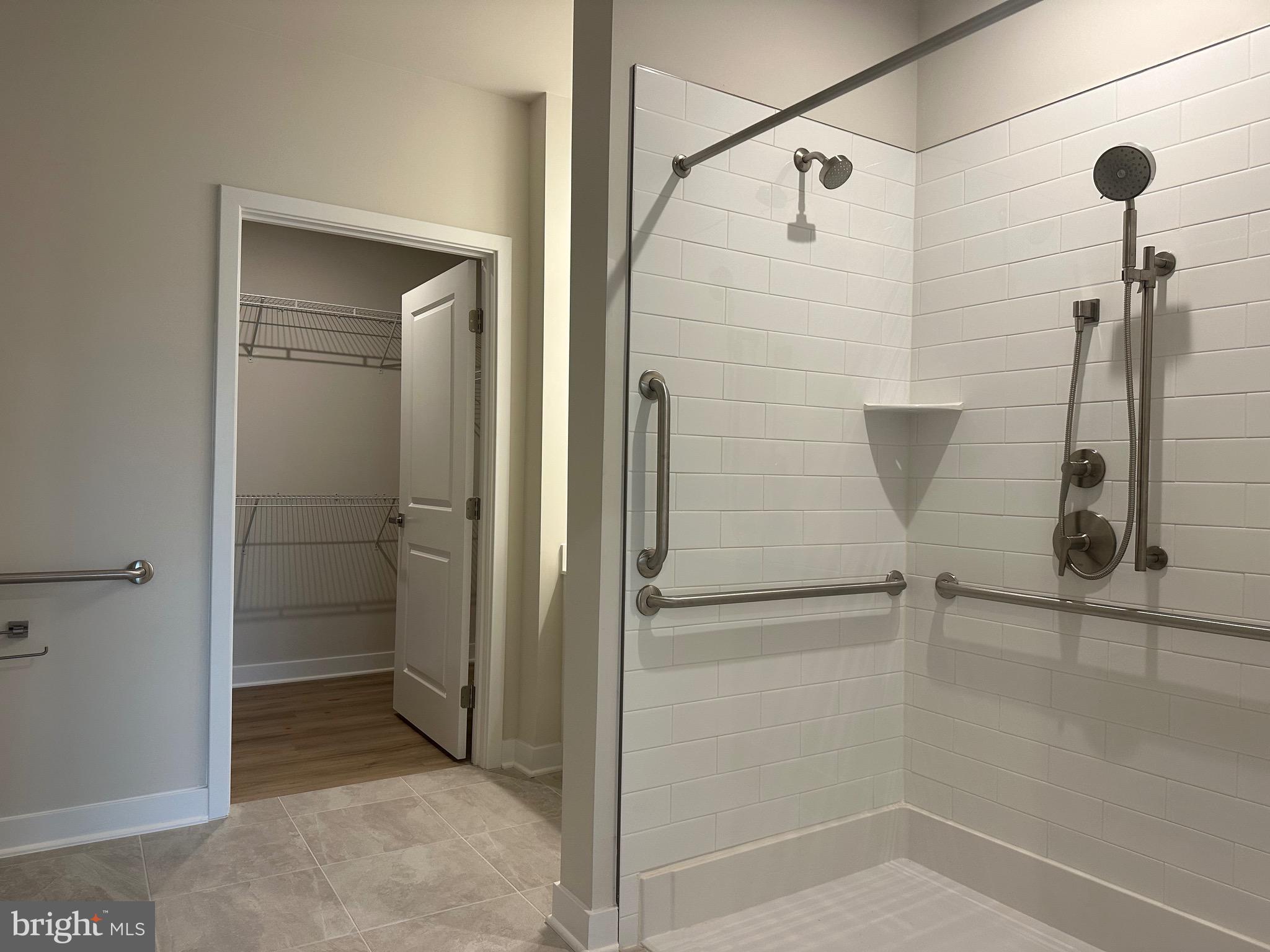 14401 Milk Thistle Lane, Unit 335 Chantilly, VA 20151 - Photo 15 of 17 a bathroom with a shower