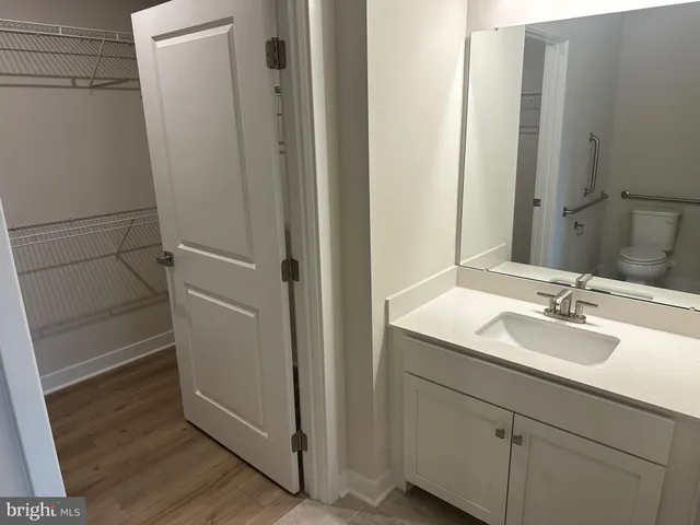 a bathroom with a sink and mirror