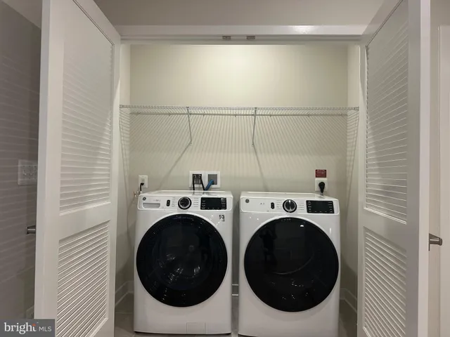 a utility room with dryer and washer