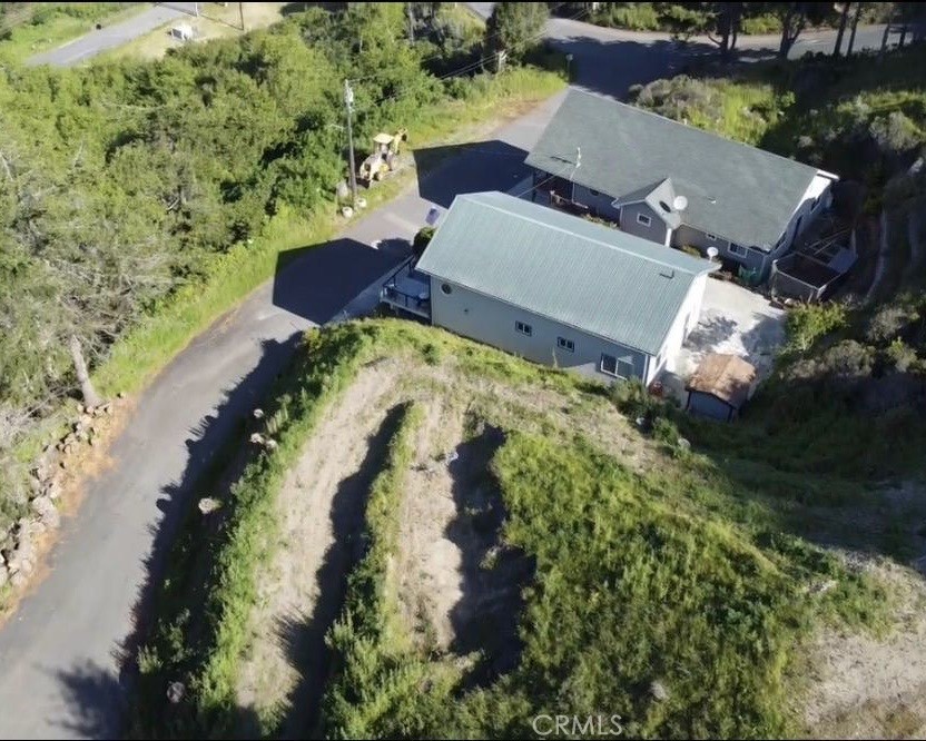 53 Redcrest Court Whitethorn, CA 95589 - Photo 4 of 5 an aerial view of a house with a yard and lake view
