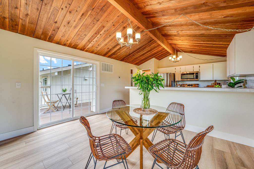 1695 Seascape Boulevard Aptos, CA 95003 - Photo 11 of 87 a dining room with furniture and potted plants