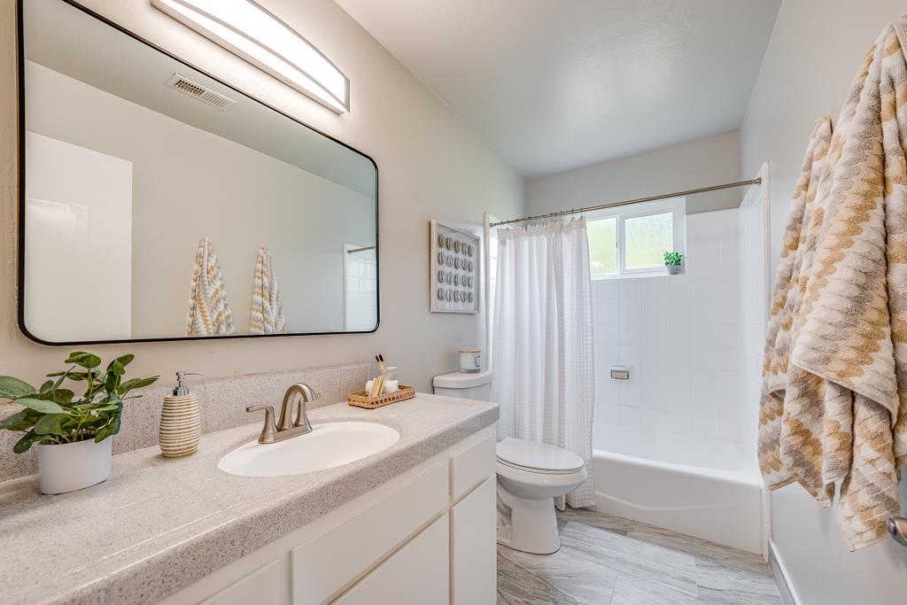 1695 Seascape Boulevard Aptos, CA 95003 - Photo 22 of 87 a bathroom with a granite countertop sink toilet and shower
