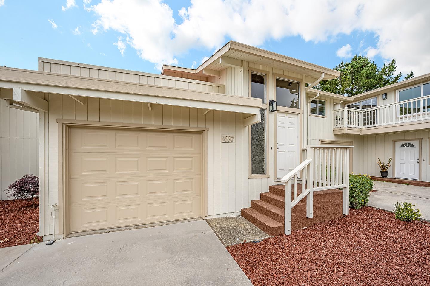 1695 Seascape Boulevard Aptos, CA 95003 - Photo 26 of 87 a front view of a house with a yard