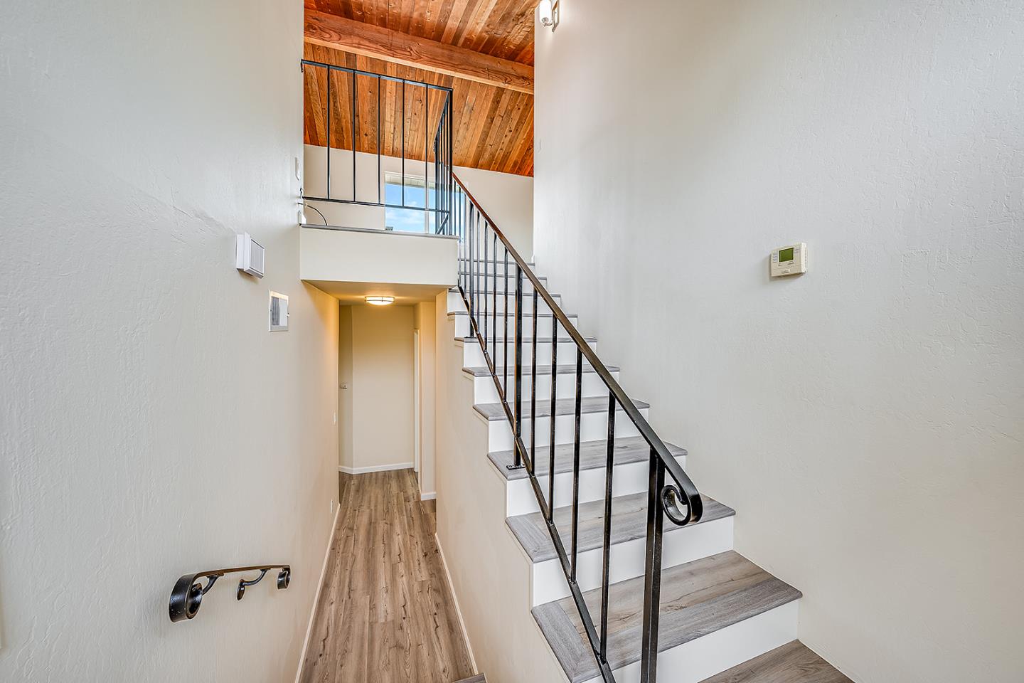 1695 Seascape Boulevard Aptos, CA 95003 - Photo 28 of 87 a view of a hallway with wooden floor and staircase