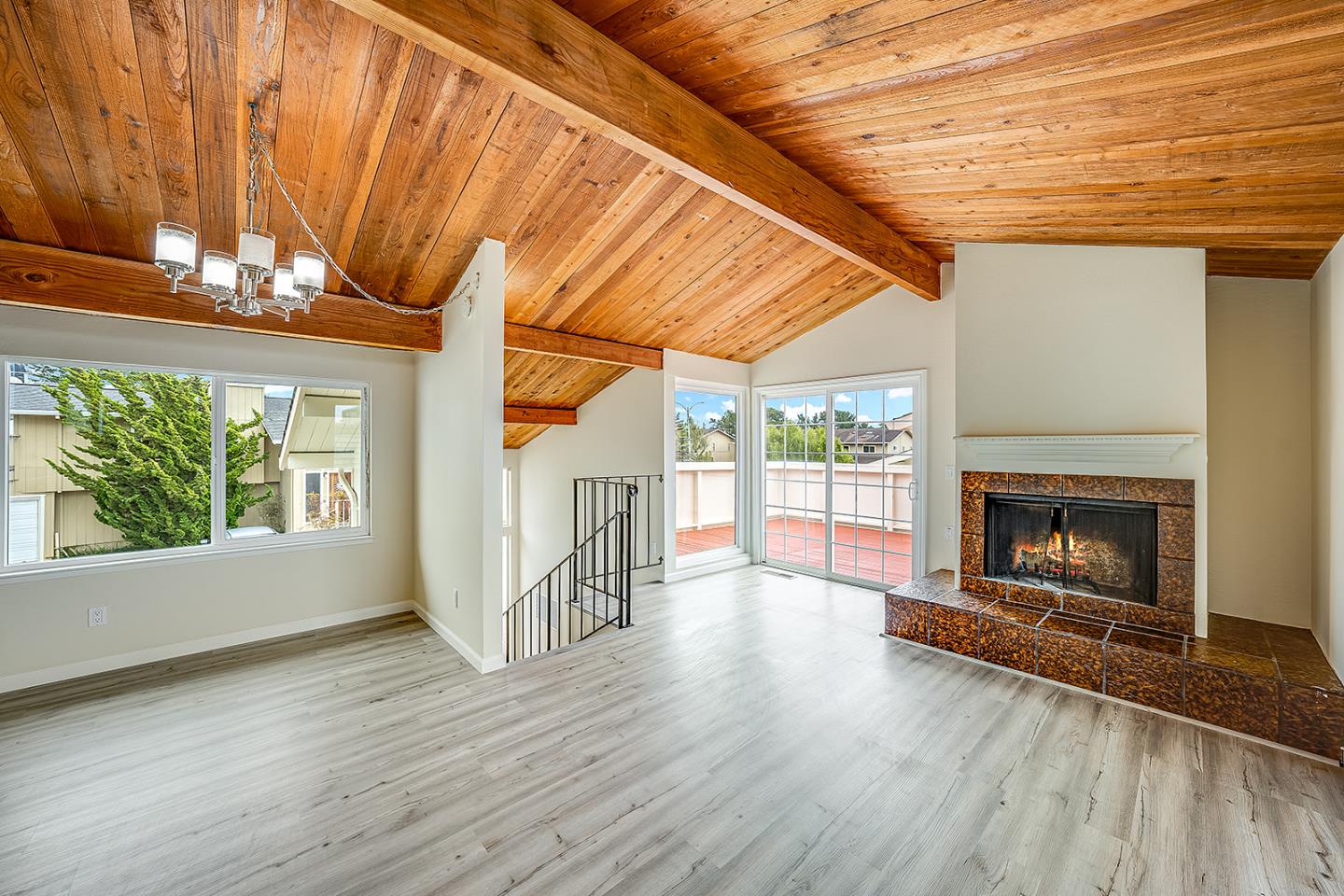 1695 Seascape Boulevard Aptos, CA 95003 - Photo 29 of 87 a view of a room with wooden floor a fireplace and windows