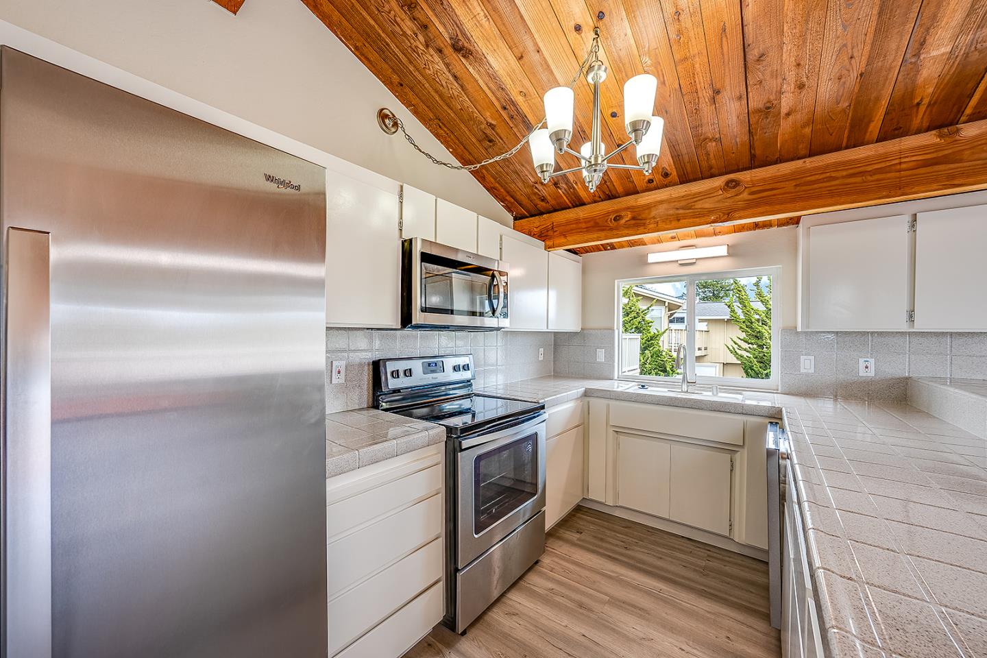 1695 Seascape Boulevard Aptos, CA 95003 - Photo 36 of 87 a kitchen with stainless steel appliances a white cabinets and a stove top oven