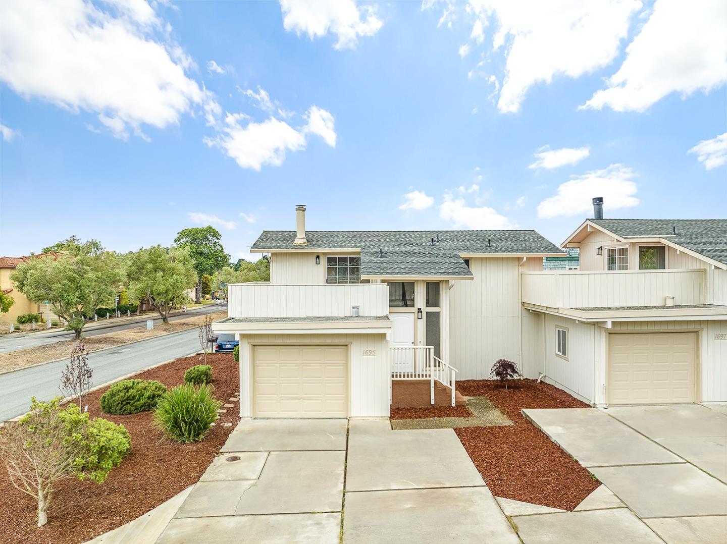 1695 Seascape Boulevard Aptos, CA 95003 - Photo 49 of 87 a view of a white house with a swimming pool and outdoor seating