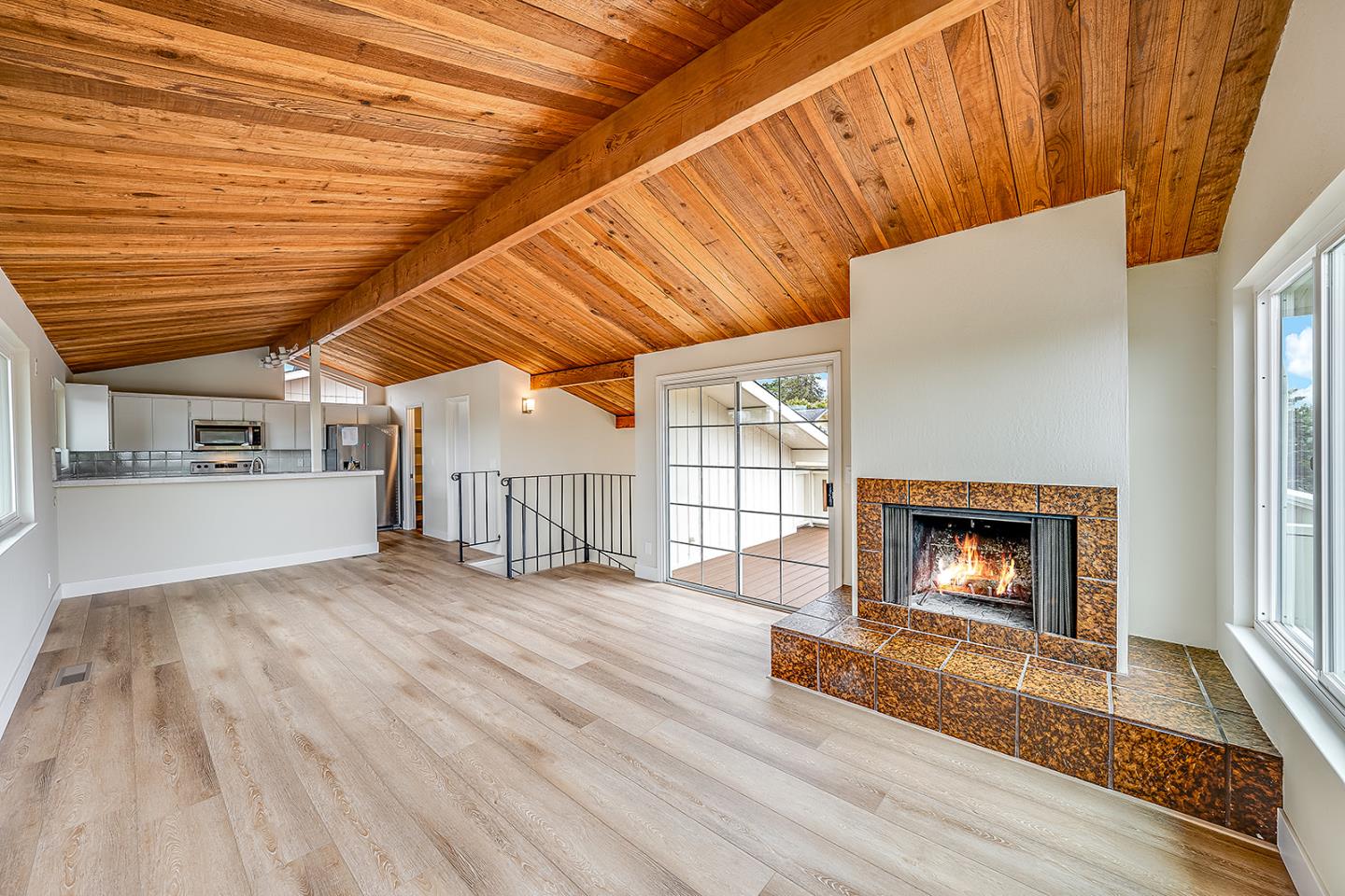 1695 Seascape Boulevard Aptos, CA 95003 - Photo 57 of 87 a view of an empty room with wooden floor fireplace and a window