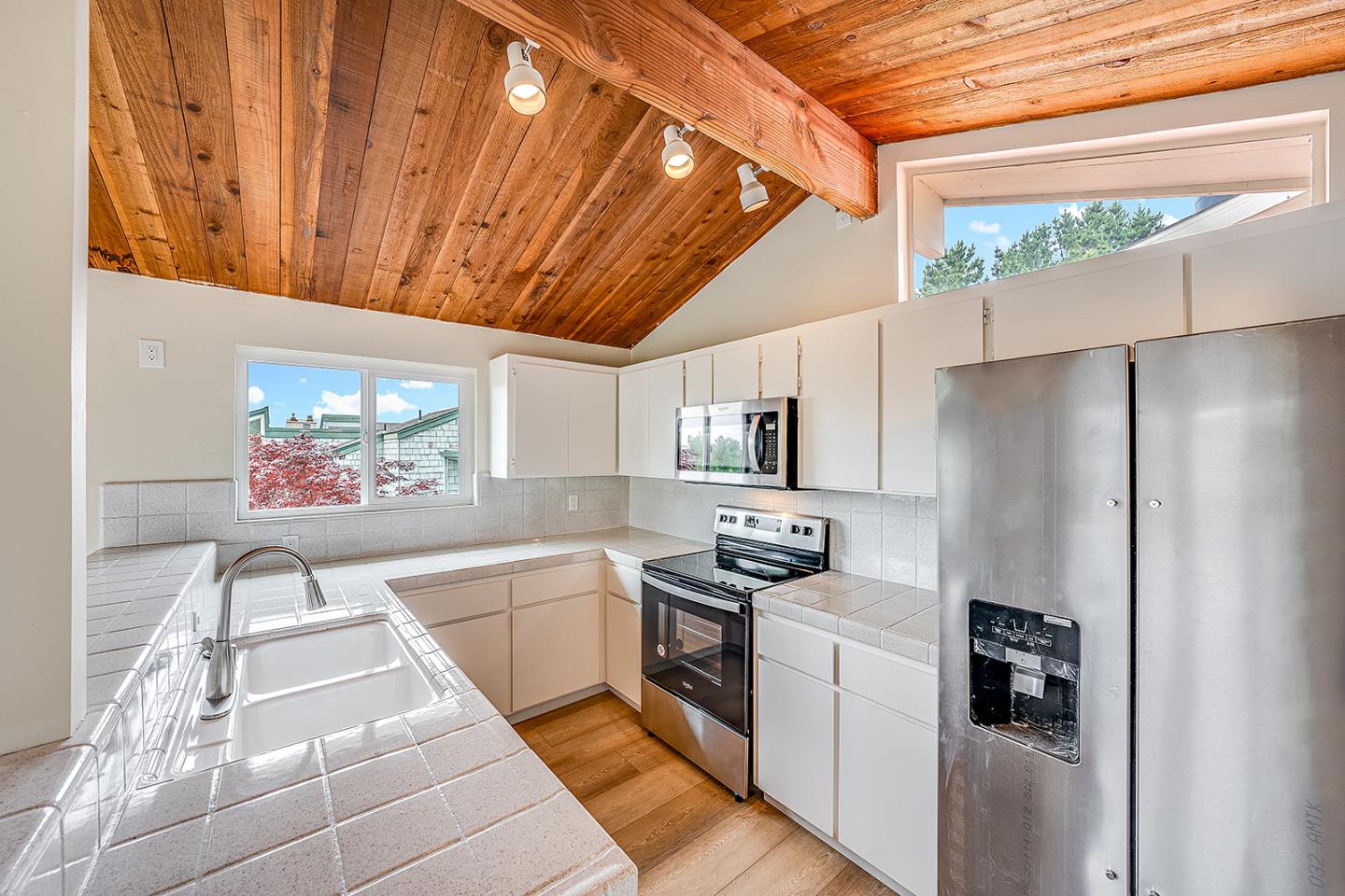 1695 Seascape Boulevard Aptos, CA 95003 - Photo 61 of 87 a kitchen with stainless steel appliances a refrigerator a sink a stove top oven a counter space and cabinets