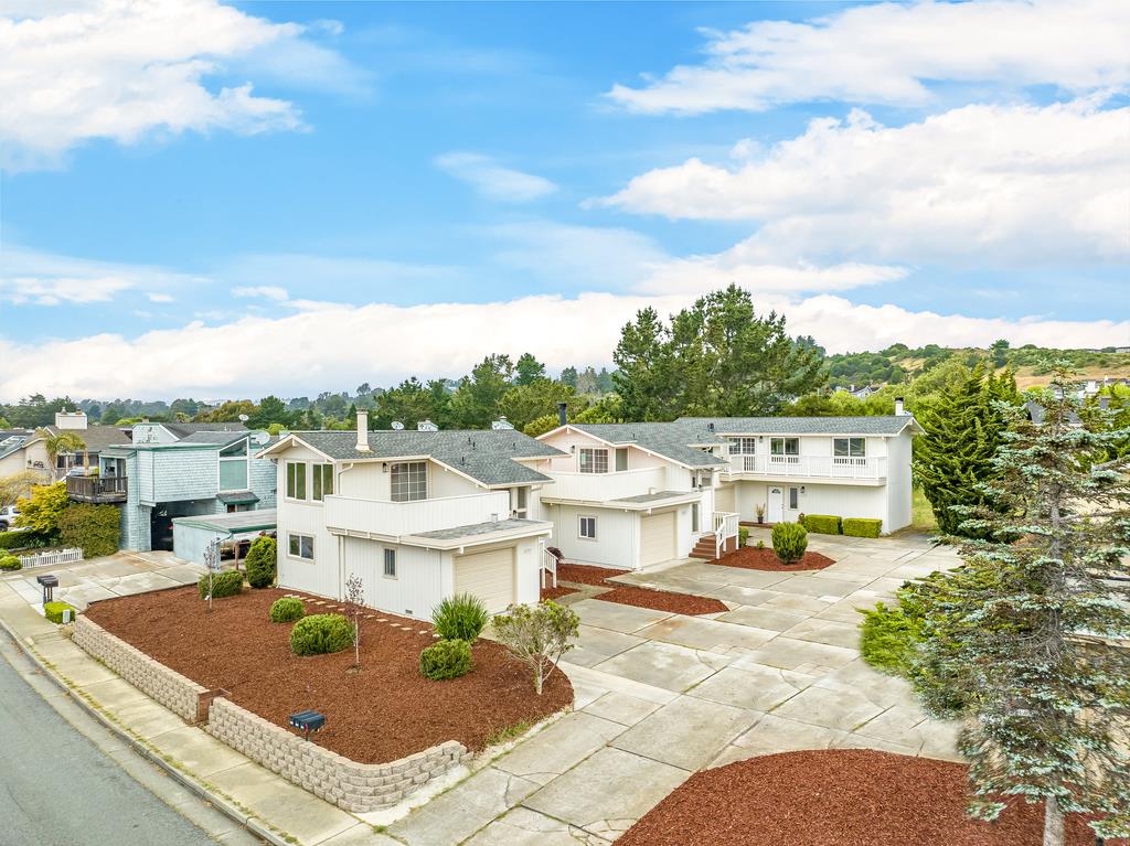 1695 Seascape Boulevard Aptos, CA 95003 - Photo 79 of 87 a view of a white house with a big yard and potted plants