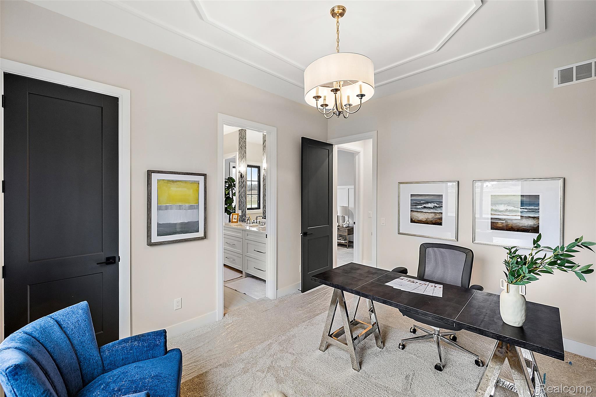 70413 Renata Court Romeo, MI 48065 - Photo 50 of 53 Sophisticated home office featuring soaring ceilings with crown molding, a polished concrete-finish desk surface, and black architectural doors