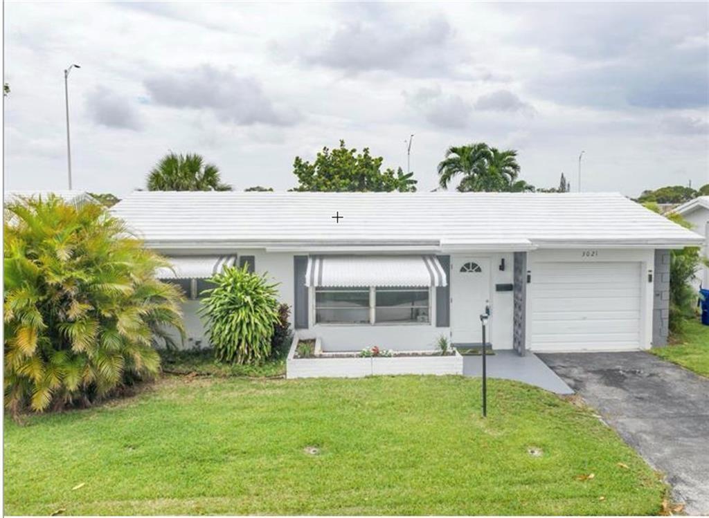 a house view with a garden space