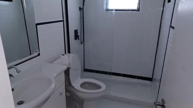 a bathroom with a sink and a washer dryer