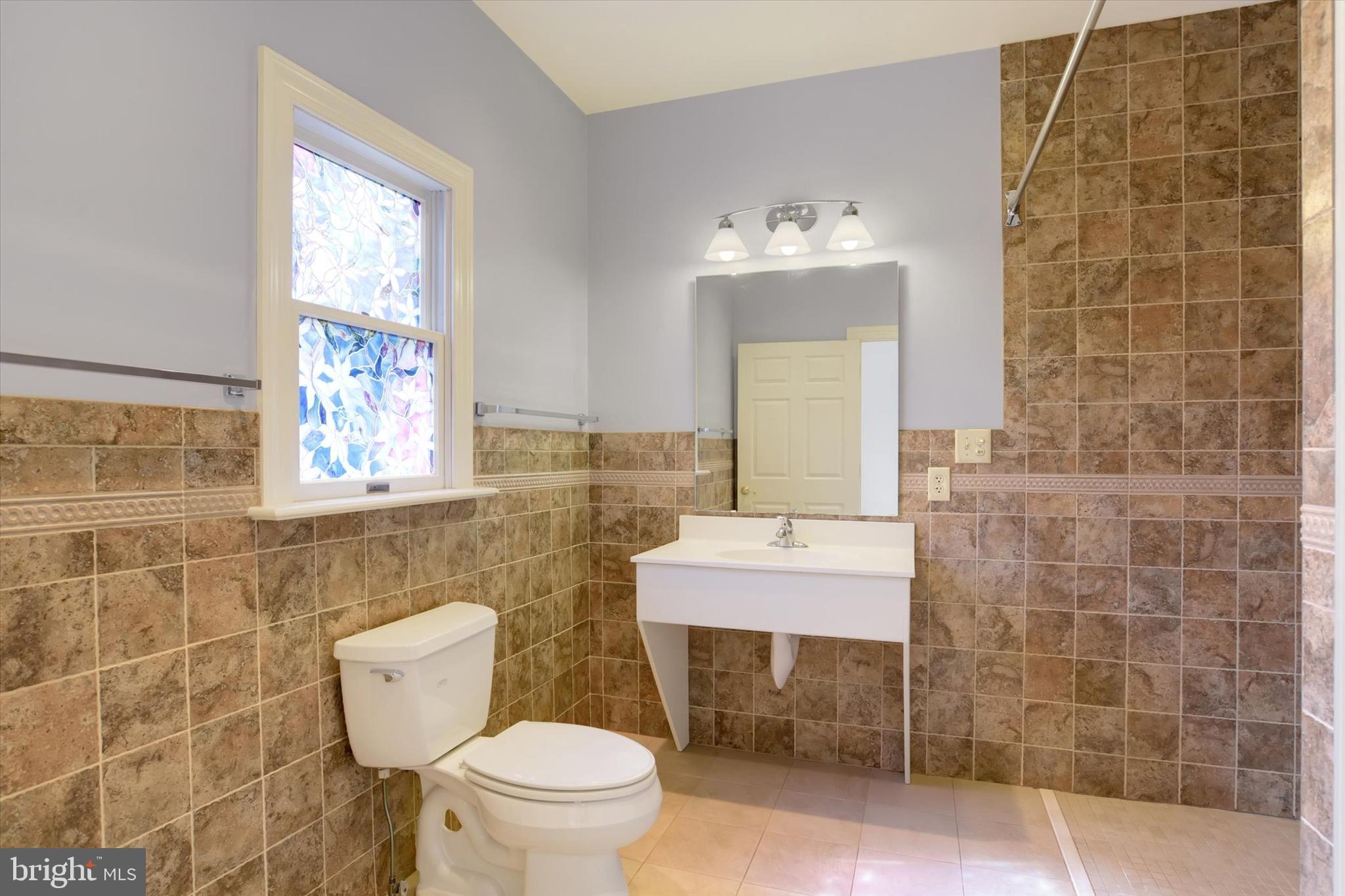 4420 Rathlin Court Harrisburg, PA 17112 - Photo 20 of 41 a bathroom with a sink a toilet and mirror