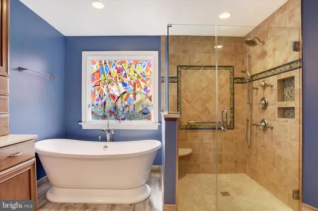 a bathroom with a bathtub and shower