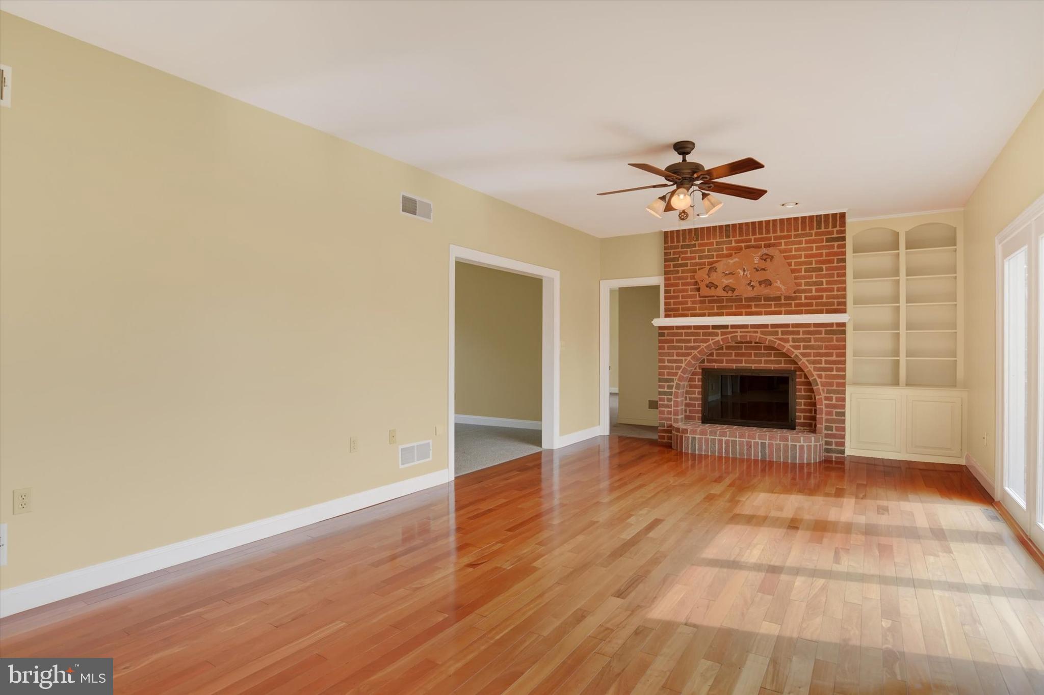4420 Rathlin Court Harrisburg, PA 17112 - Photo 7 of 41 a view of an empty room with a fireplace and a window