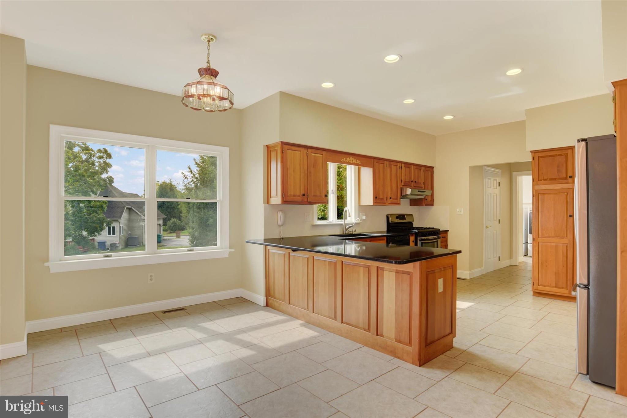 4420 Rathlin Court Harrisburg, PA 17112 - Photo 10 of 41 a kitchen with stainless steel appliances granite countertop a stove and a sink