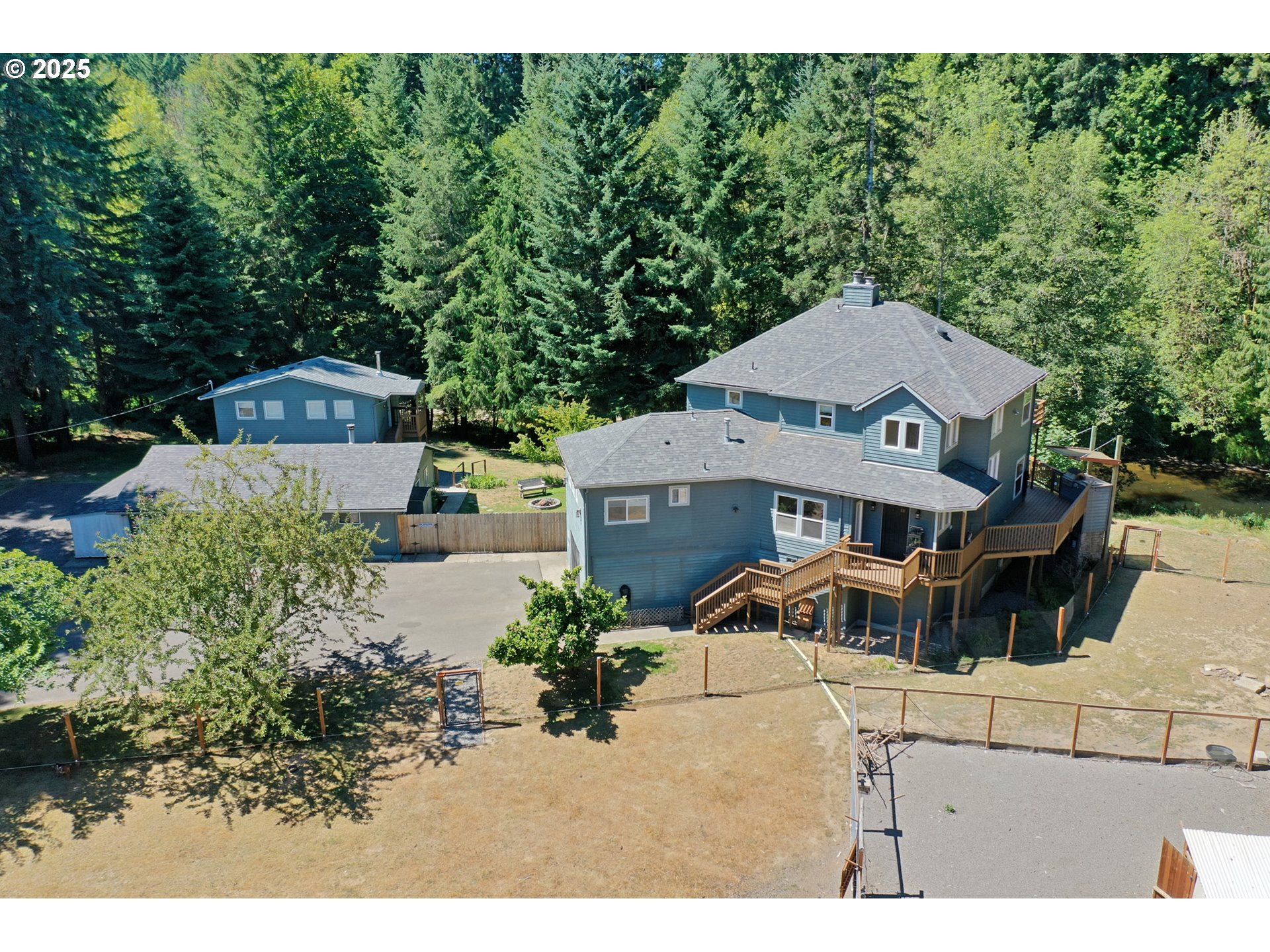 64977 Nehalem Highway North Vernonia, OR 97064 - Photo 1 of 48 a view of a house with a yard