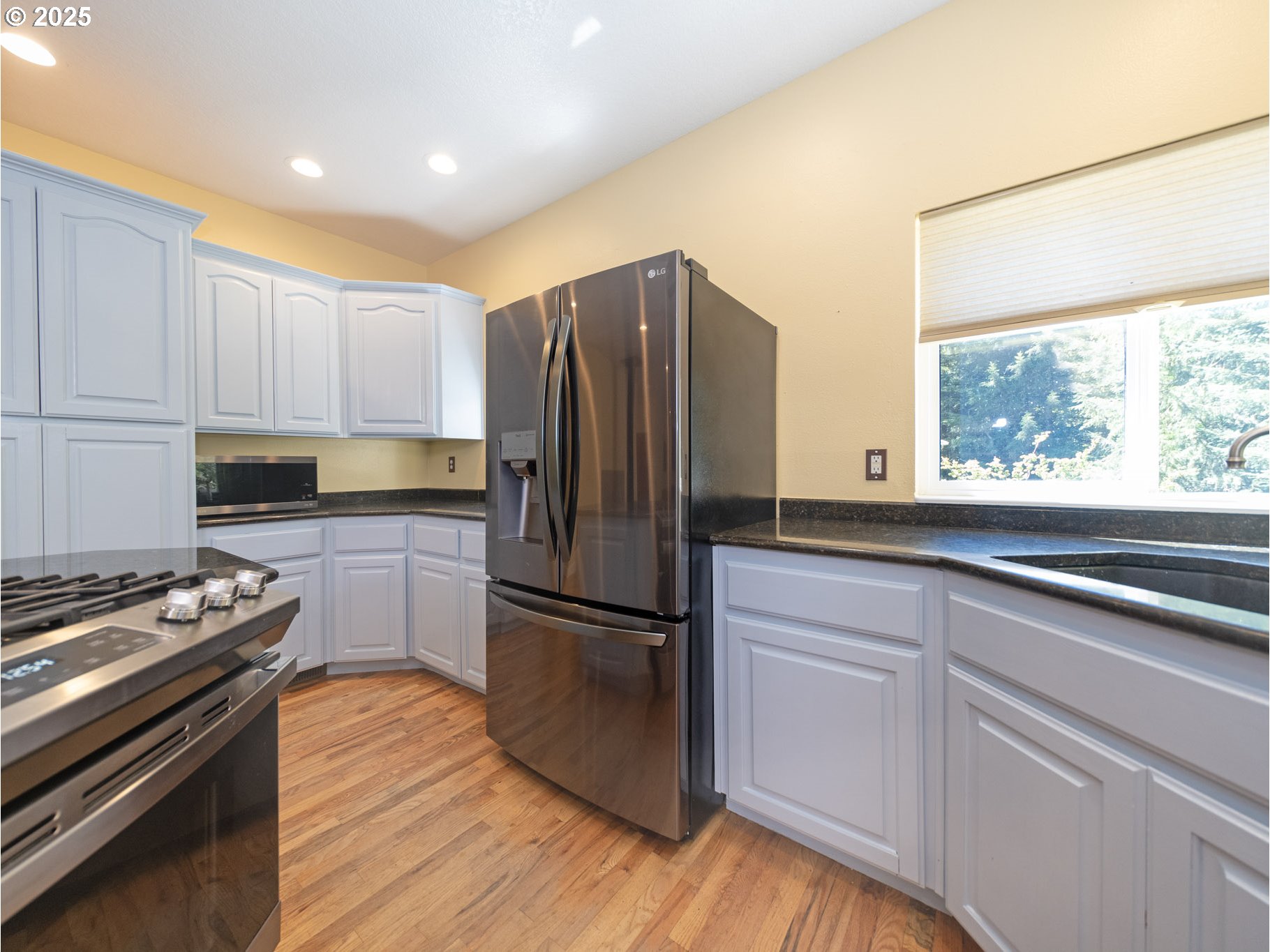 64977 Nehalem Highway North Vernonia, OR 97064 - Photo 12 of 48 a kitchen with a refrigerator and a stove top oven