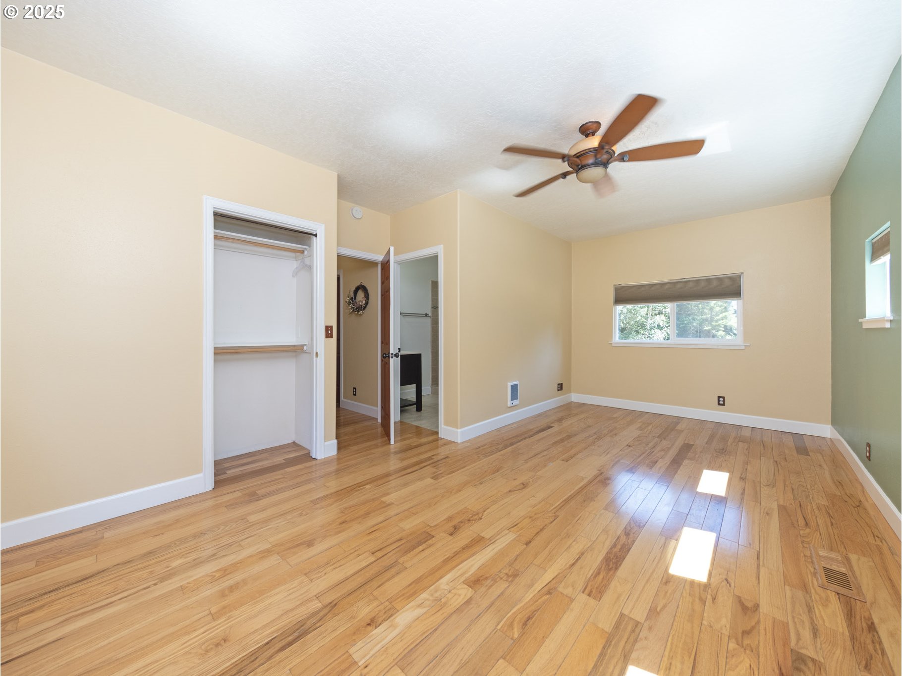 64977 Nehalem Highway North Vernonia, OR 97064 - Photo 15 of 48 a view of empty room with wooden floor and fan